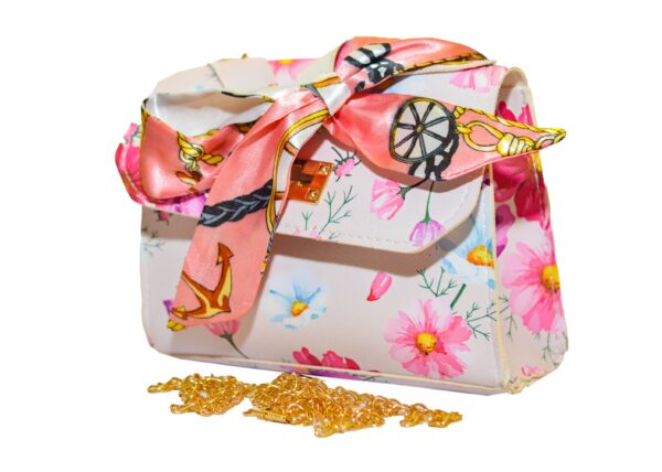 Leather handbag with flowery embossed chain and silk scarf attachment Handbag made of multicolored leather with a scarf and flowers