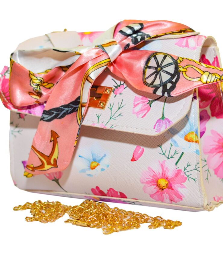 Leather handbag with flowery embossed chain and silk scarf attachment